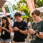 Users engaging with the KO66 app at a lively market, enjoying unique experiences.