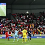 Exciting football match atmosphere capturing مباريات اليوم with fans cheering and players in action.